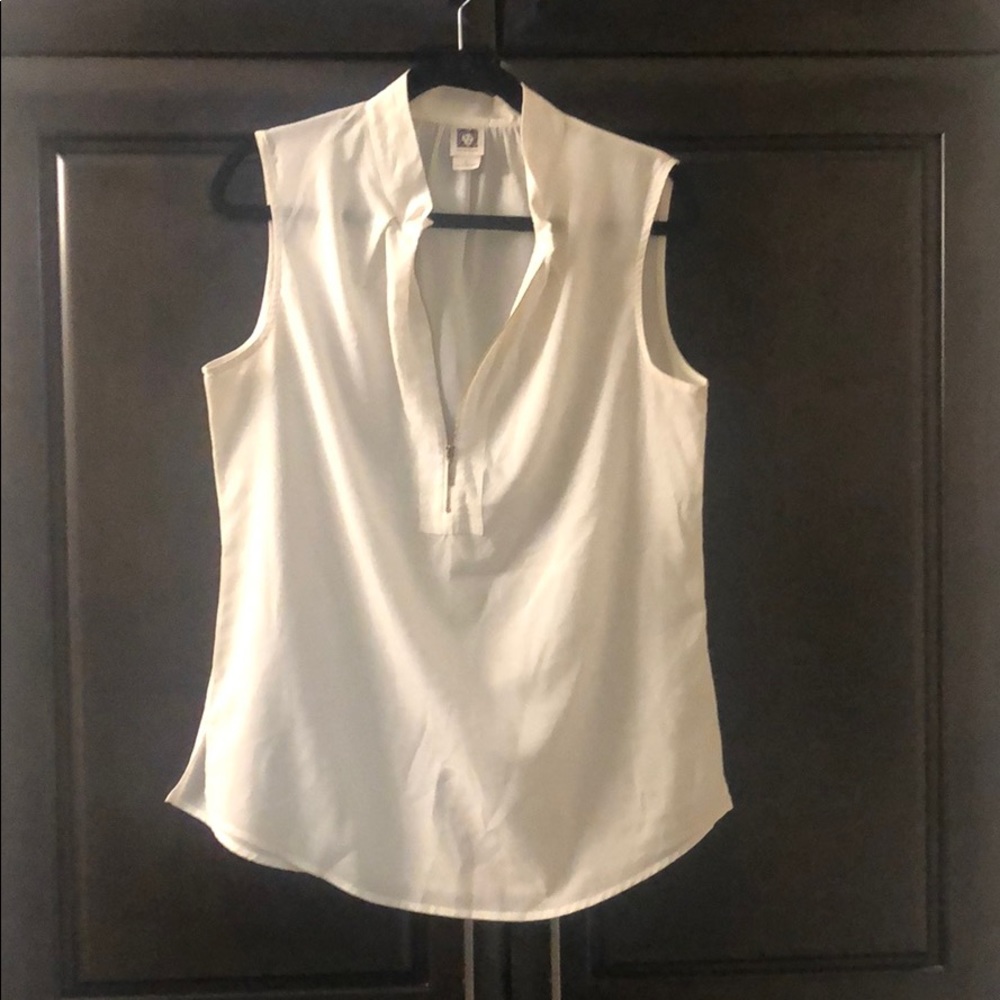 Dressy sleeveless blouse with zipper close neckline and mandarine collar